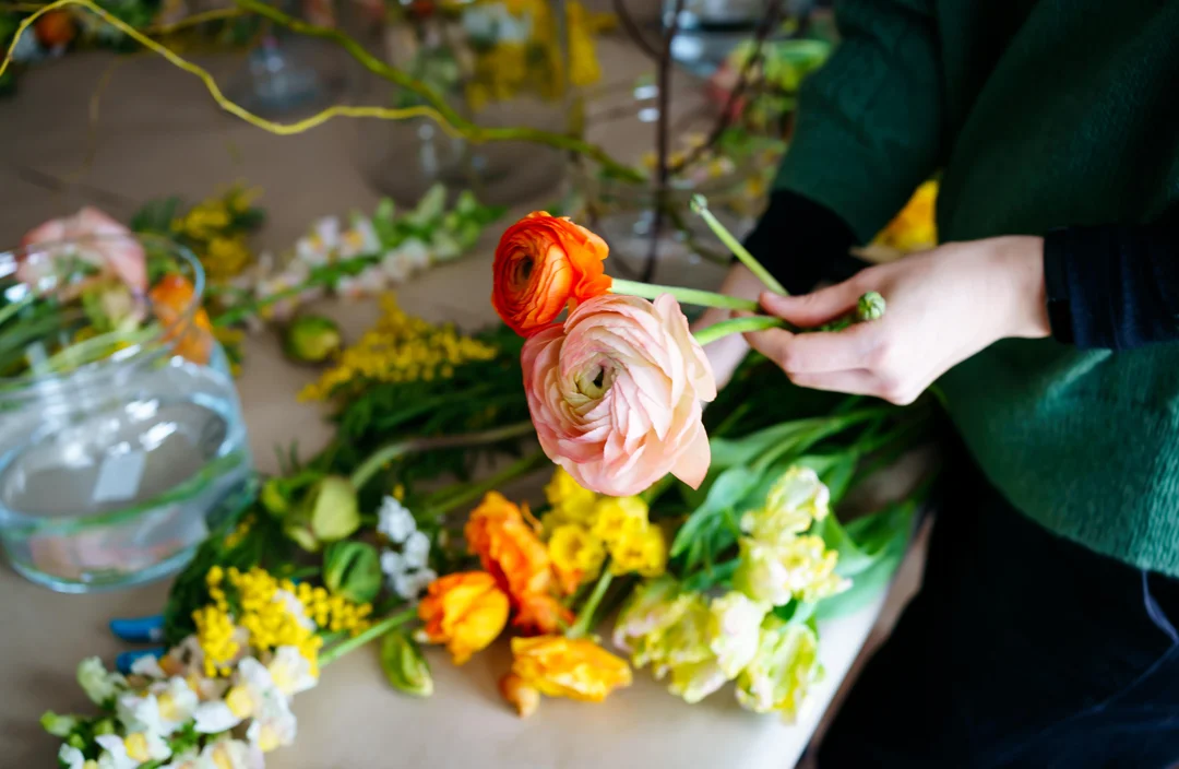 An elegant table centerpiece showcasing seasonal blooms and artistic composition.